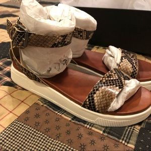 Size 9 platform sandals. Brand new in box.